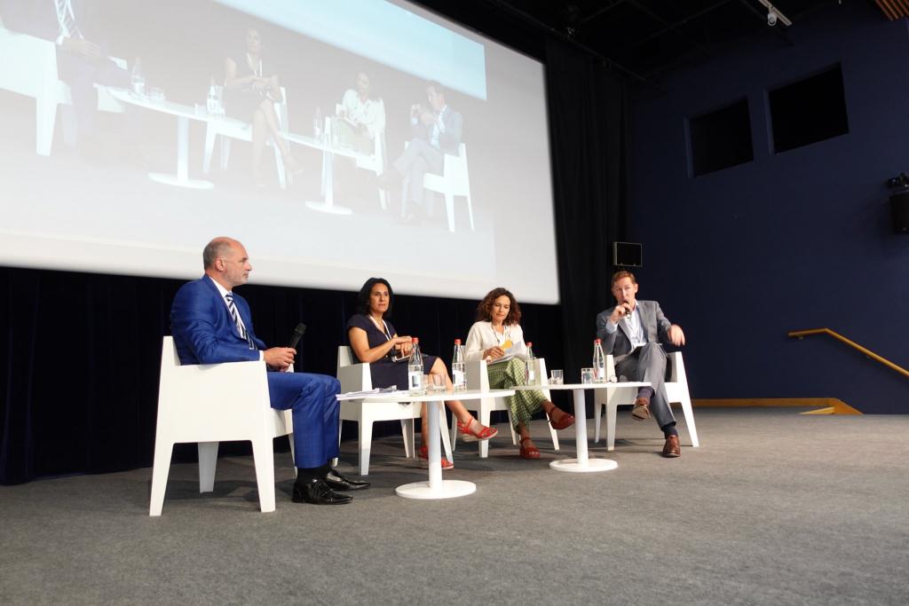 group of four panellists on stage