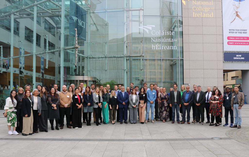 Group photo of GreenShift consortium partners standing outside the National College of Ireland building for a project kick-off meeting.