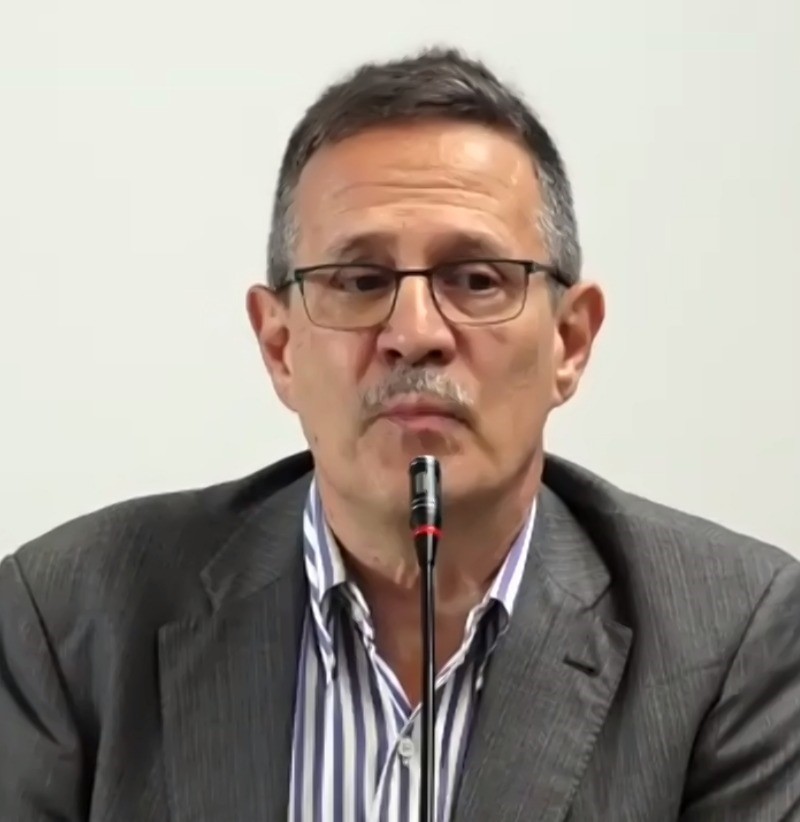 Stefano Kluzer, a man with glasses and brown short hair