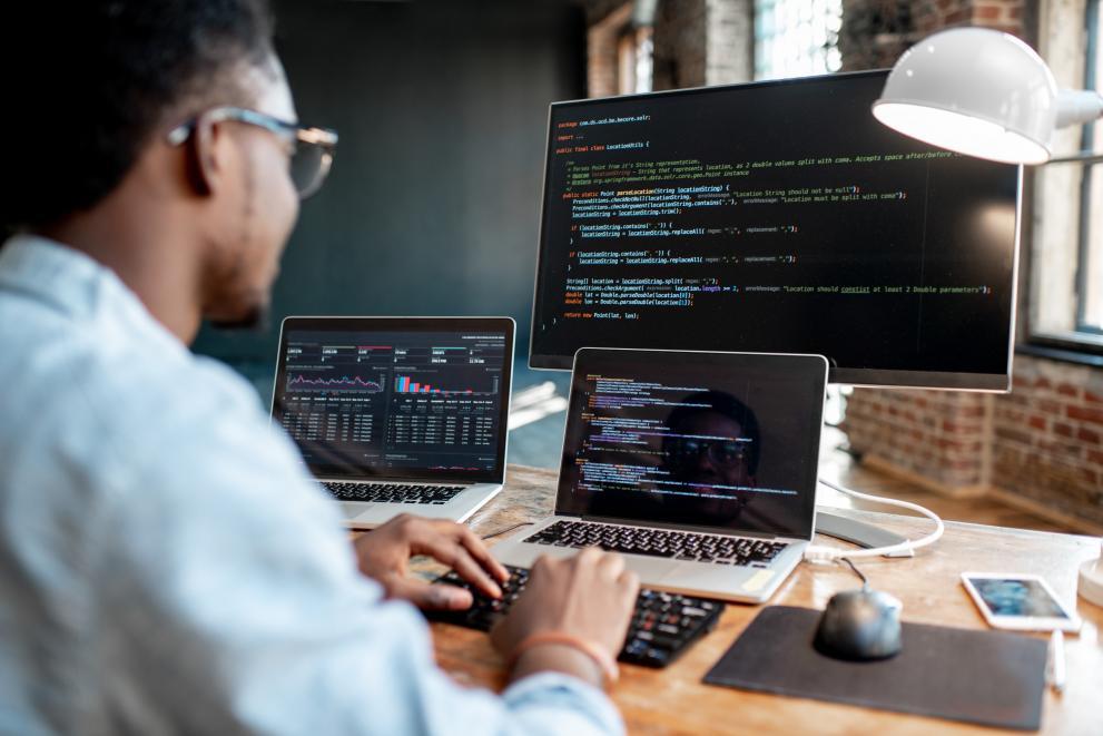 Man working at a computer - AdobeStock_234092554 AdobeStock_234092554