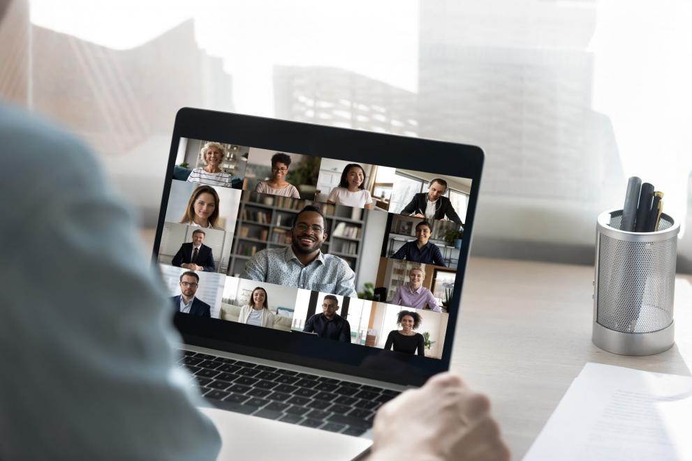 A person on a conference call with an entire team A person on a conference call with an entire team