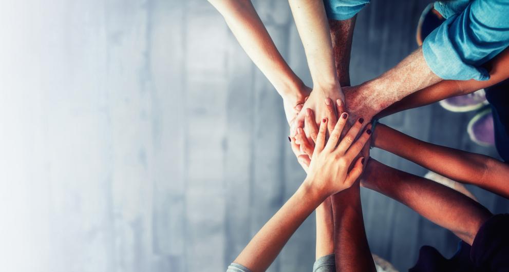 Working together to close the skills gap Hands stretched together, as a sign of cooperation