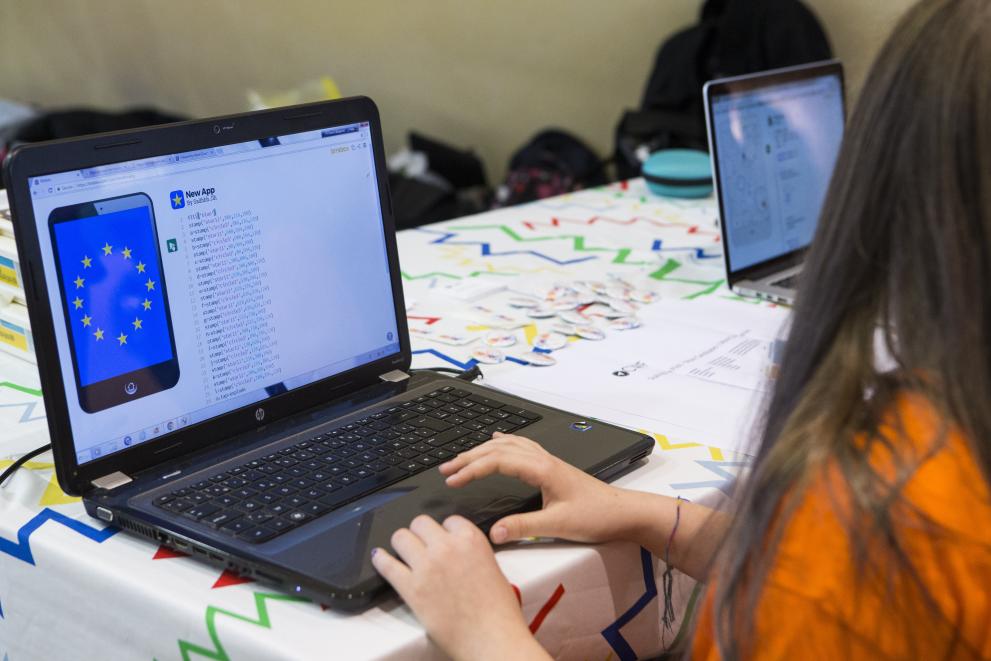 A young girl coding on a laptop computer, EC Audiovisual Service A young girl coding on a laptop computer