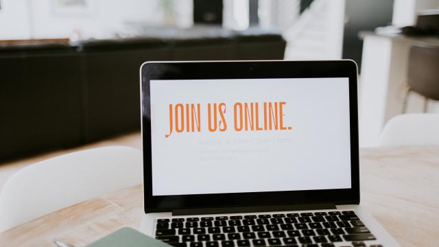 Photo of a, open laptop with text on the screen reading "Join us online"