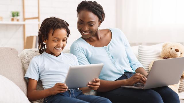 image of mother and daughter using technologies for work