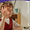 Pic shows a child in front of a tablet