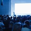 Business and Entrepreneurship concept. Speaker giving a talk in conference hall at business event. Audience at the conference hall