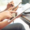 Freepik designed image - photo of a person's hands working on a tablet 